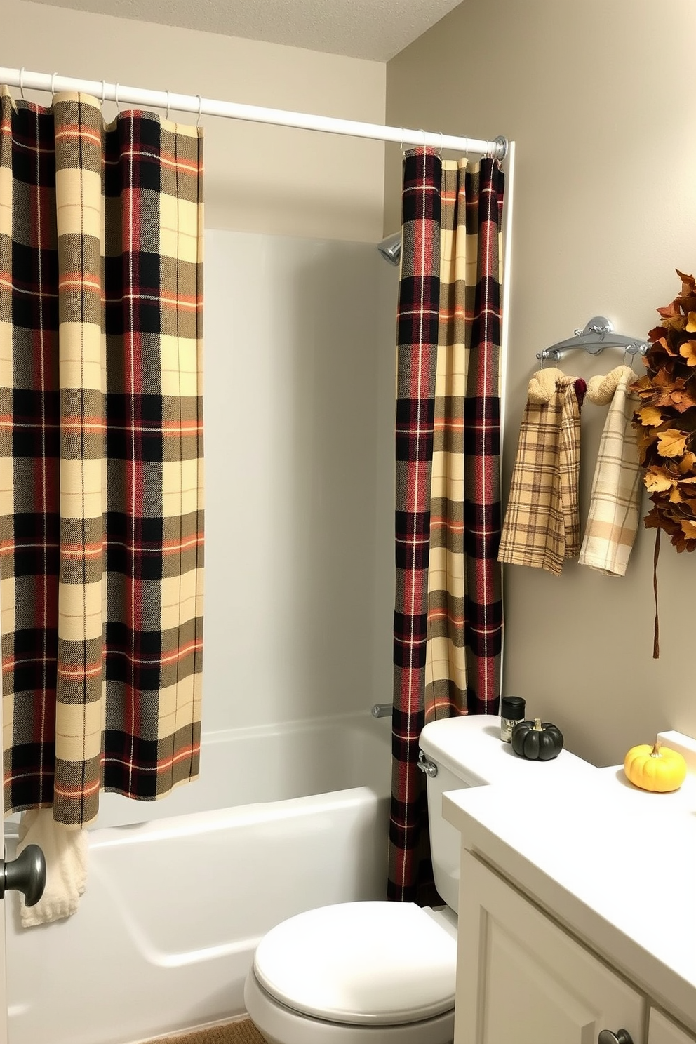 A cozy bathroom setting featuring a plaid shower curtain that adds warmth and texture to the space. The walls are adorned with autumn-themed decorations, including small pumpkins and dried leaves, creating a seasonal ambiance.