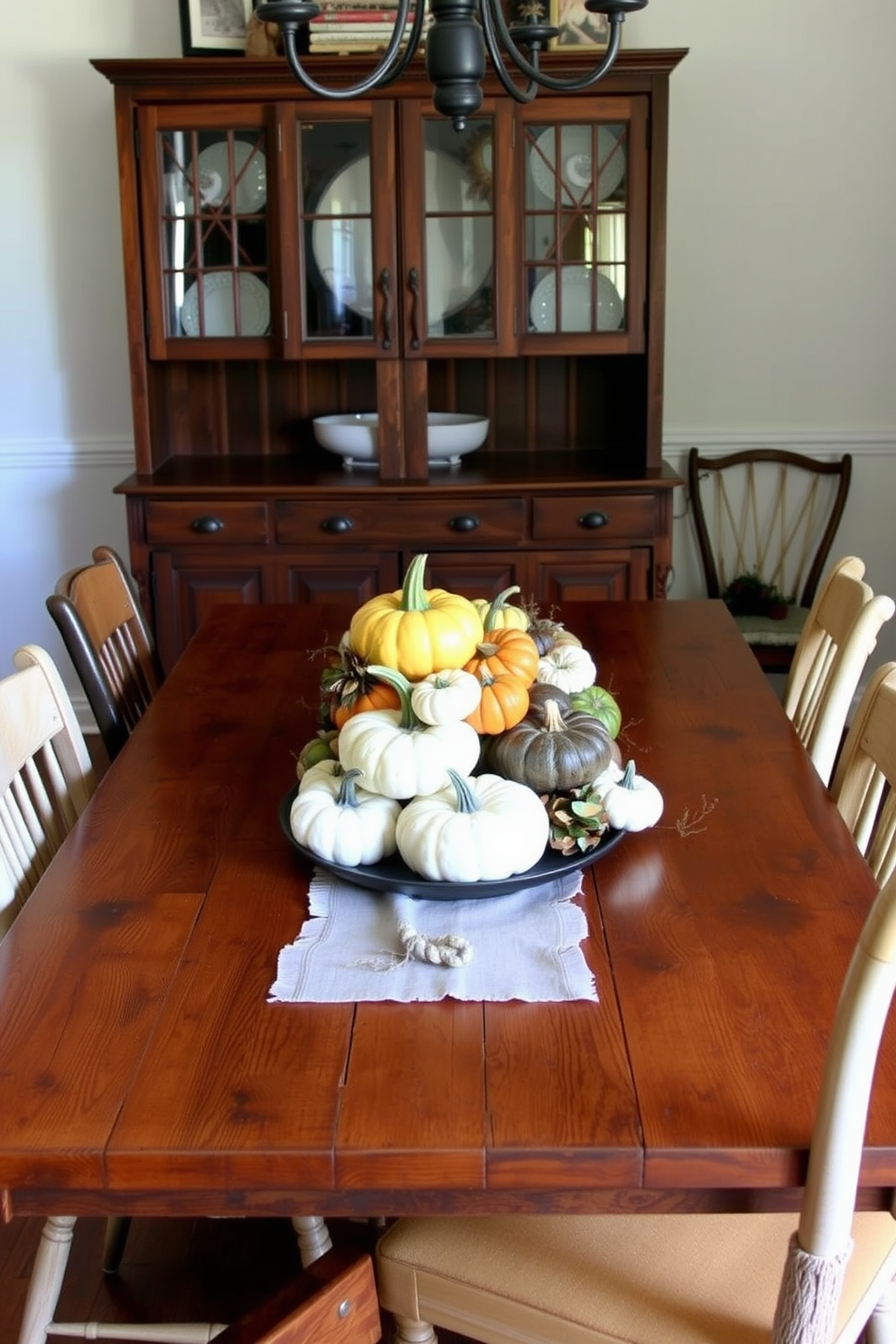 A cozy fall dining room adorned with rustic wooden chargers on the table. The chargers are layered with elegant dinnerware, complemented by warm autumn hues in the table linens and centerpieces.