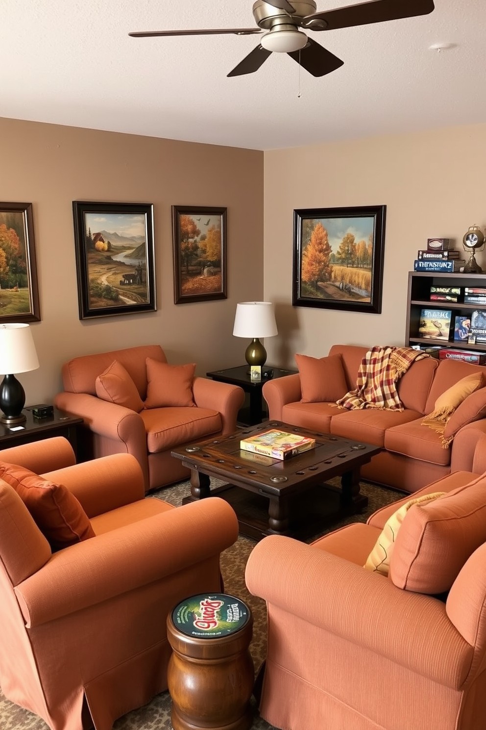 A cozy game room featuring comfortable seating with soft fabrics in warm autumn colors. Plush armchairs and a large sectional sofa are arranged around a rustic coffee table, inviting relaxation and conversation. The walls are adorned with framed artwork depicting fall landscapes and seasonal themes. A warm throw blanket drapes over one of the sofas, and a selection of board games is neatly displayed on a nearby shelf.