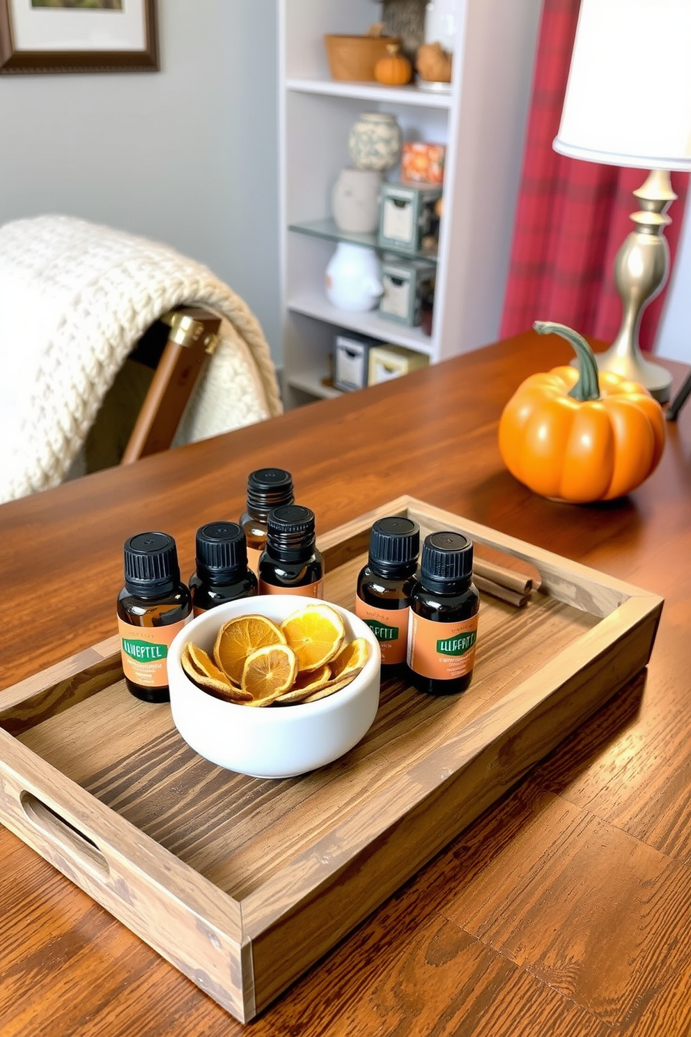 Create a cozy fall scent diffuser station featuring a rustic wooden tray. The tray holds an assortment of essential oils in amber glass bottles alongside a small ceramic dish filled with dried orange slices and cinnamon sticks. Design a warm and inviting home office that incorporates autumn colors and textures. A wooden desk is adorned with a soft throw blanket, a pumpkin centerpiece, and a stylish desk lamp that casts a warm glow.