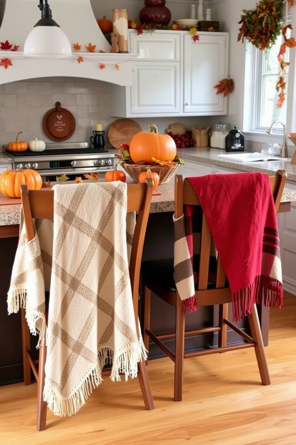 A cozy kitchen scene featuring warm throw blankets draped over the backs of wooden chairs. The space is adorned with autumn-themed decorations, including pumpkins and colorful leaves scattered across the countertops.