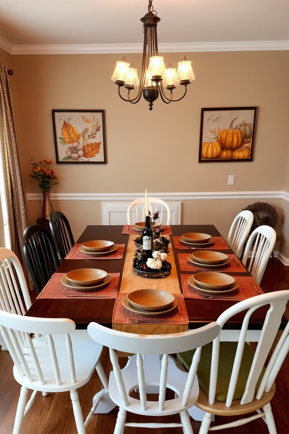 A cozy dining room adorned with fall-colored table runners and placemats. The table is set with rustic wooden dishes and surrounded by mismatched chairs, creating a warm and inviting atmosphere. On the walls, seasonal artwork featuring autumn leaves and pumpkins adds a festive touch. Soft, ambient lighting from a chandelier enhances the inviting feel of the space.