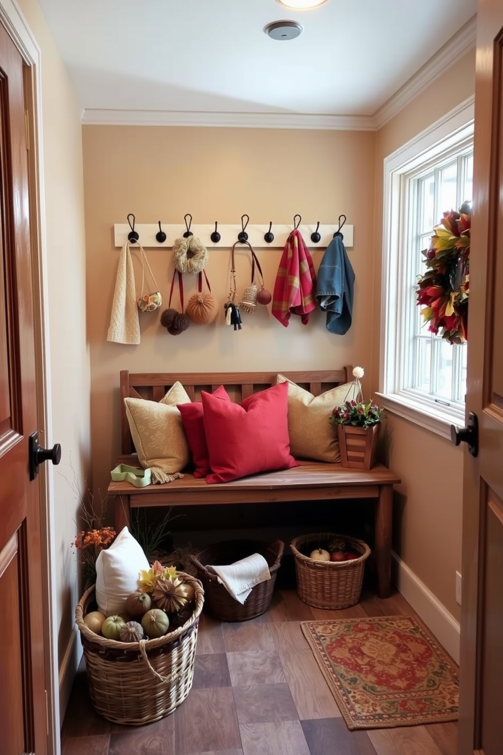 A cozy laundry room with wall-mounted hooks for seasonal accessories. The walls are painted in a warm beige tone, and a rustic wooden bench sits beneath the hooks, adorned with colorful throw pillows. Baskets filled with autumn-themed decorations are placed on the floor, adding a touch of seasonal charm. A large window allows natural light to flood the space, highlighting the rich textures of the decor.