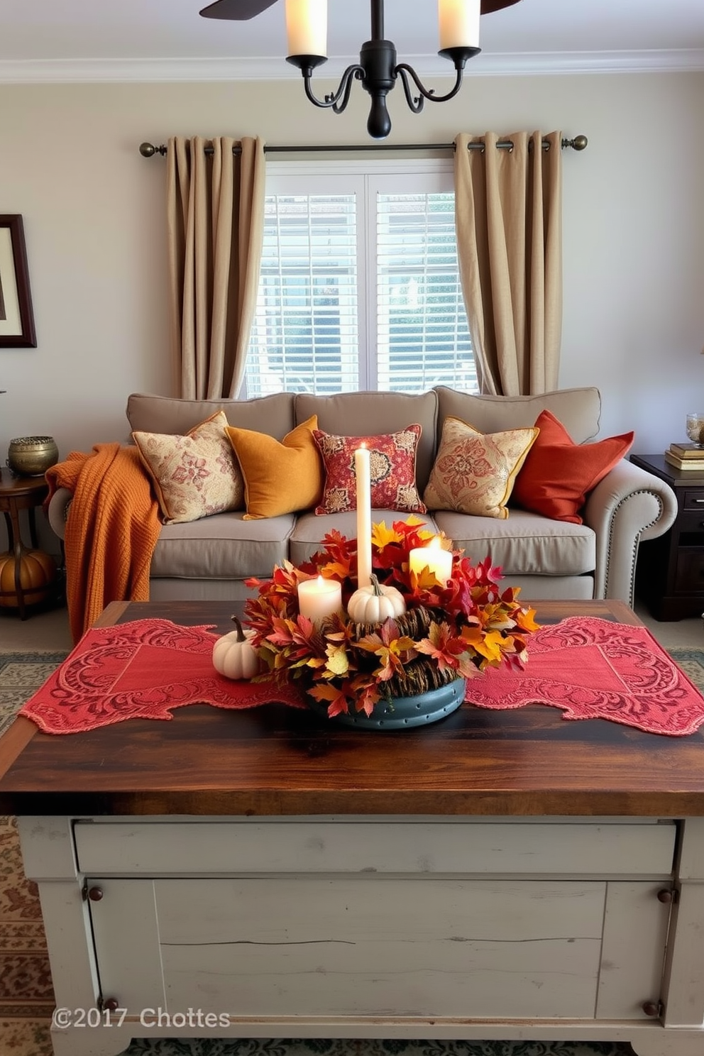 A cozy living room adorned with autumn-inspired table runners. The table is set with warm-toned decorations, including pumpkins and candles, creating a welcoming atmosphere. Richly colored throw pillows in shades of orange and gold are scattered on the sofa. A rustic coffee table features a centerpiece of seasonal foliage, enhancing the fall theme.