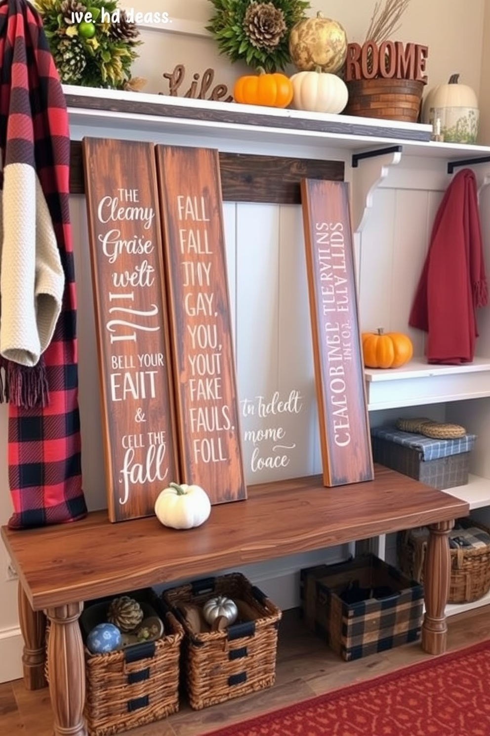 Wooden signs with fall sayings are artfully arranged on a rustic wooden bench. The warm tones of the signs complement the cozy atmosphere, inviting guests to embrace the autumn spirit. The mudroom is decorated with seasonal accents, featuring a mix of plaid and knitted textures. A collection of pumpkins and gourds are placed on a shelf, adding vibrant colors and a festive touch to the space.