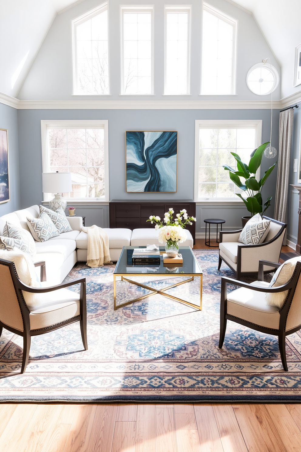 A cozy family room featuring a cohesive color scheme that blends soft blues and warm neutrals. The space includes a plush sectional sofa adorned with patterned throw pillows and a large area rug that ties the colors together. Natural light floods the room through oversized windows, illuminating the artwork on the walls. A stylish coffee table sits in the center, surrounded by elegant accent chairs that enhance the inviting atmosphere.