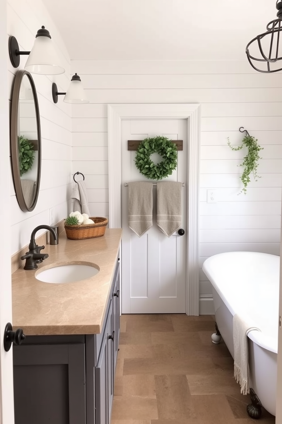 A farmhouse bathroom featuring exposed brick walls and large industrial-style windows that let in ample natural light. The centerpiece is a freestanding soaking tub with a matte black finish, complemented by a vintage-style faucet in brushed nickel. Rustic wooden shelves are mounted above the toilet, displaying neatly folded towels and potted plants. The floor is covered with large, distressed wood planks, adding warmth and character to the space.