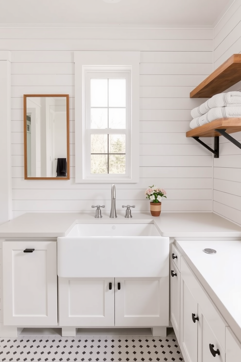 A charming farmhouse bathroom featuring a large farmhouse sink with sleek modern fixtures. The space is adorned with shiplap walls painted in a soft white, complemented by rustic wooden shelves displaying neatly folded towels.