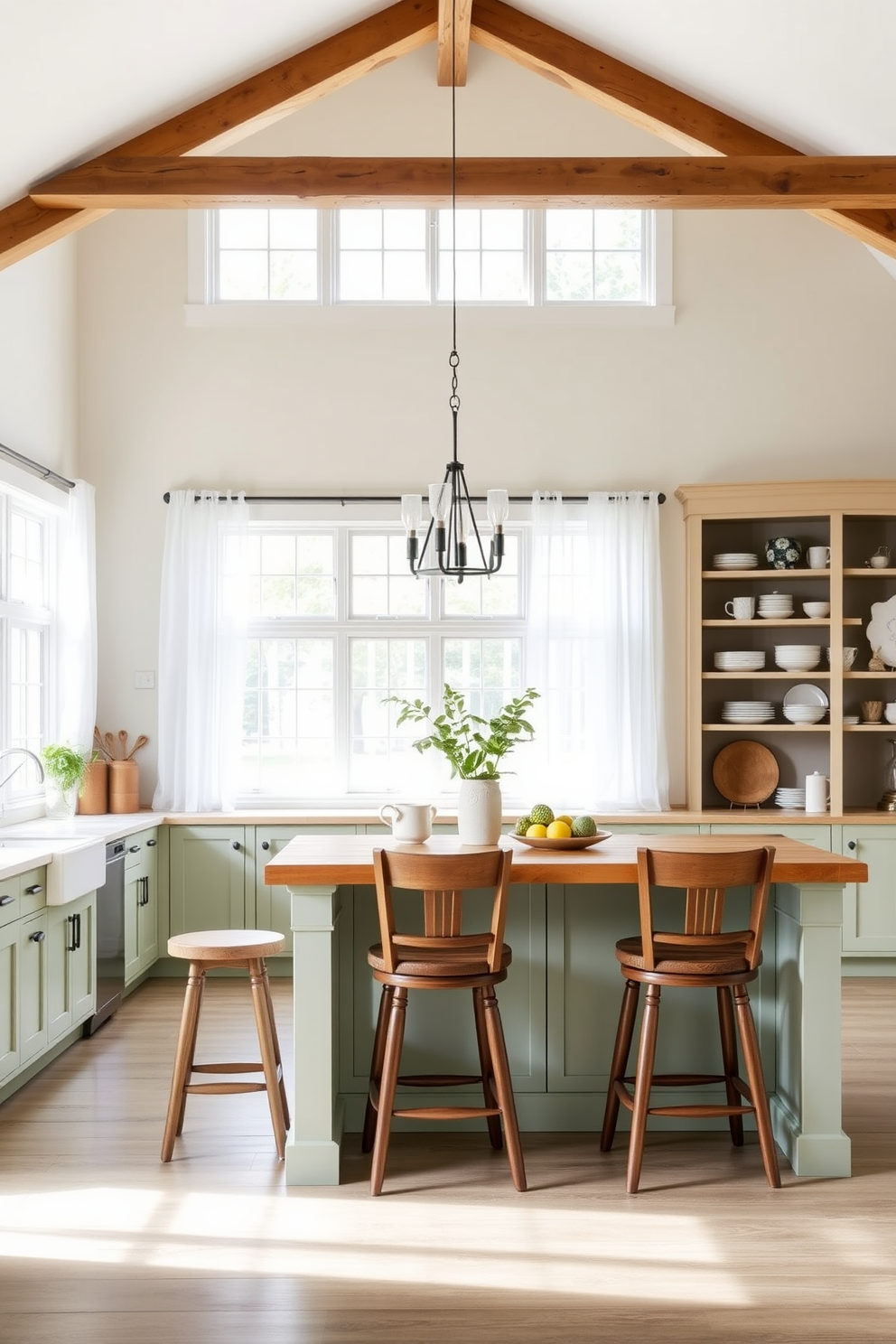 Open concept layout for spaciousness featuring a farmhouse kitchen with a large central island. The island is topped with butcher block and surrounded by high-backed wooden stools in a rustic finish. Natural light floods the space through large windows framed with sheer white curtains. The kitchen cabinets are painted in a soft sage green, complemented by open shelving displaying vintage dishware.