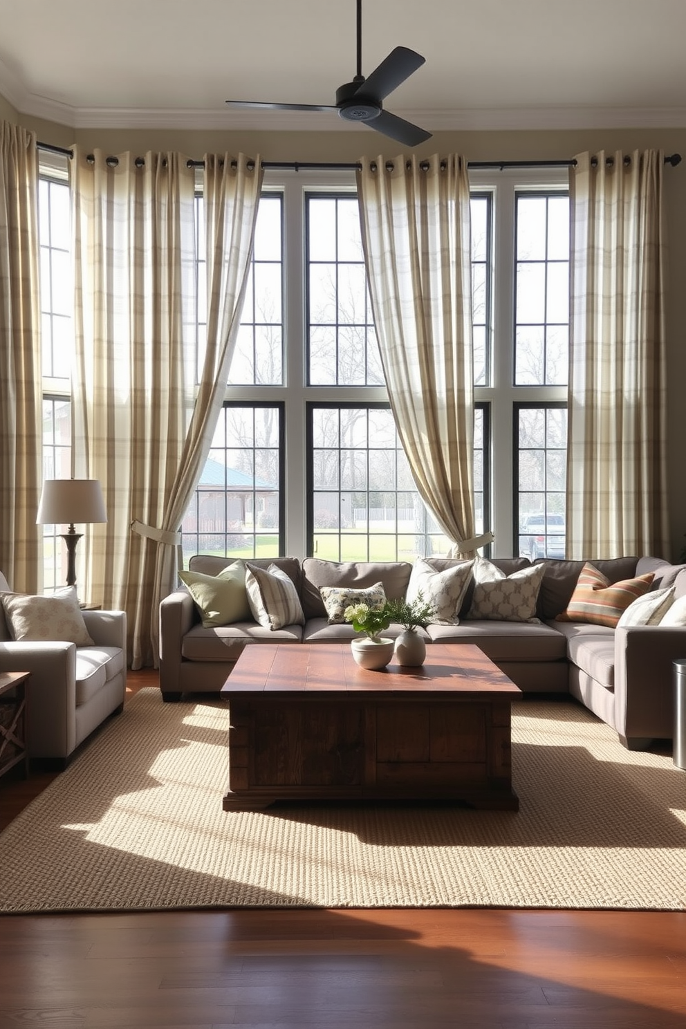 Farmhouse-style curtains drape gracefully over large windows, allowing soft natural light to filter into the room. The curtains feature a light, airy fabric in a muted plaid pattern, enhancing the cozy ambiance of the space. In the living room, a large sectional sofa is adorned with an assortment of throw pillows in varied textures and colors. A rustic coffee table made of reclaimed wood sits at the center, surrounded by a woven area rug that adds warmth to the design.