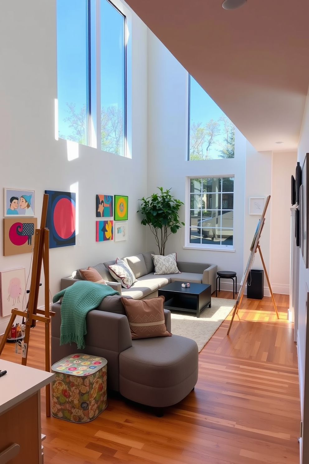 Art studio with easels and natural light. The space features large windows that allow sunlight to flood in, illuminating the wooden floors and white walls adorned with colorful artwork. Finished basement design ideas. The area includes a cozy seating arrangement with a sectional sofa, a small kitchenette for refreshments, and soft ambient lighting to create a welcoming atmosphere.