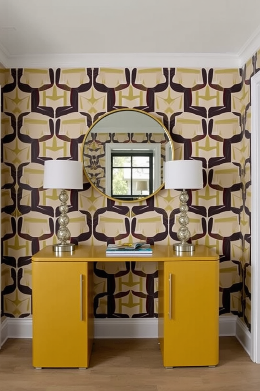 A stylish foyer featuring wallpaper with a bold geometric pattern as the backdrop. The space includes a sleek console table with a round mirror above it, complemented by a pair of decorative lamps on either side.