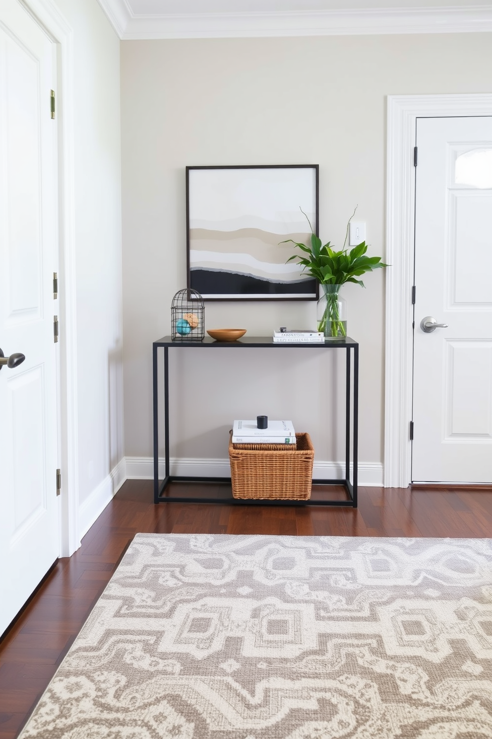 A welcoming foyer with a sleek console table positioned against the wall, perfect for holding keys and small decorative items. The walls are painted in a soft neutral tone, complemented by a stylish area rug that adds warmth and texture to the space.