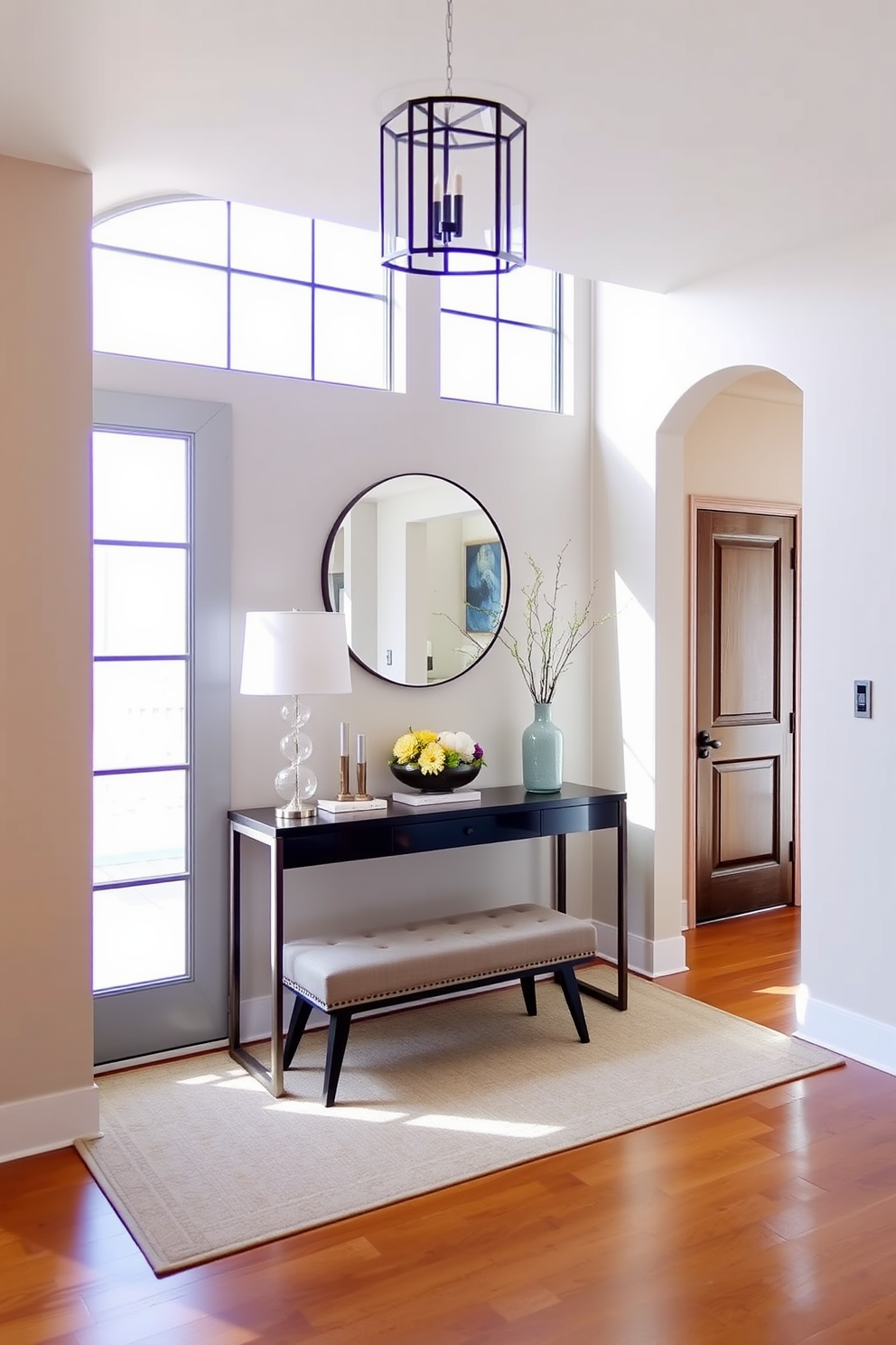 A welcoming foyer filled with natural light. The space features a sleek console table with a round mirror above it, adorned with seasonal decor such as a small pumpkin arrangement for fall or a floral display for spring. The walls are painted in a soft beige, complementing the warm wooden flooring. A cozy area rug lies beneath the table, and a stylish bench provides seating, inviting guests to linger.