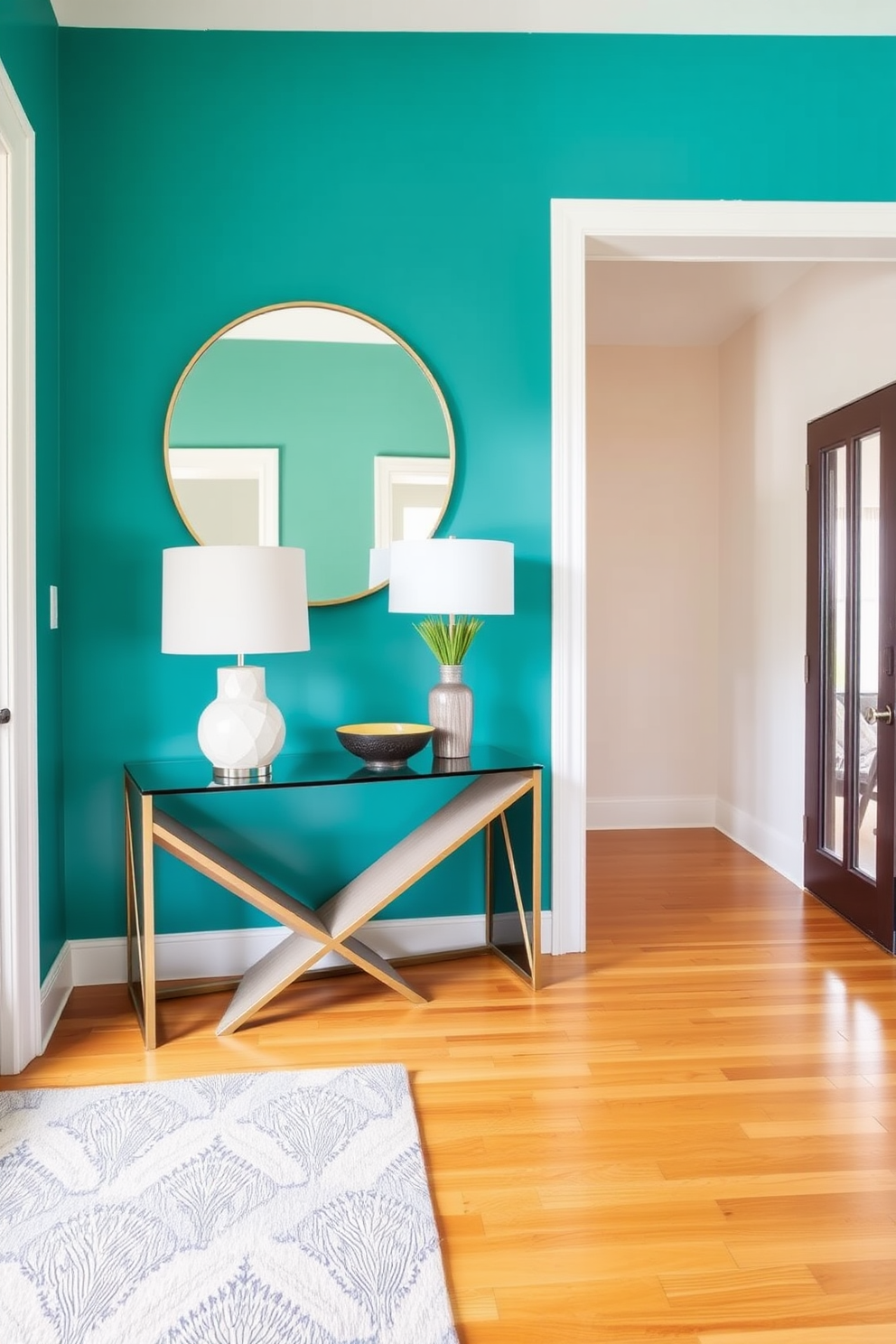 A vibrant accent wall painted in a bold teal hue creates a stunning focal point in the foyer. The space features a sleek console table with a geometric design, adorned with decorative bowls and a stylish lamp. Warm wooden flooring complements the colorful wall, adding a natural element to the entryway. A large round mirror hangs above the console table, reflecting light and enhancing the sense of space.