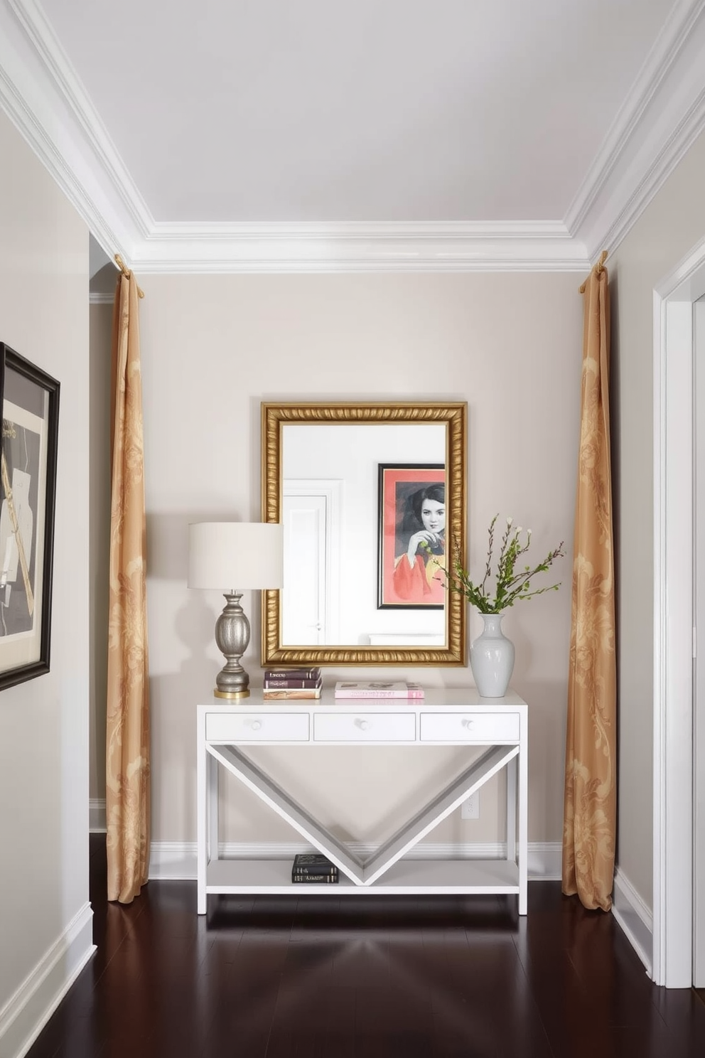 A welcoming foyer featuring fabric-covered panels that add softness and texture to the space. The walls are adorned with elegant artwork, and a stylish console table sits beneath a large mirror, creating an inviting atmosphere.