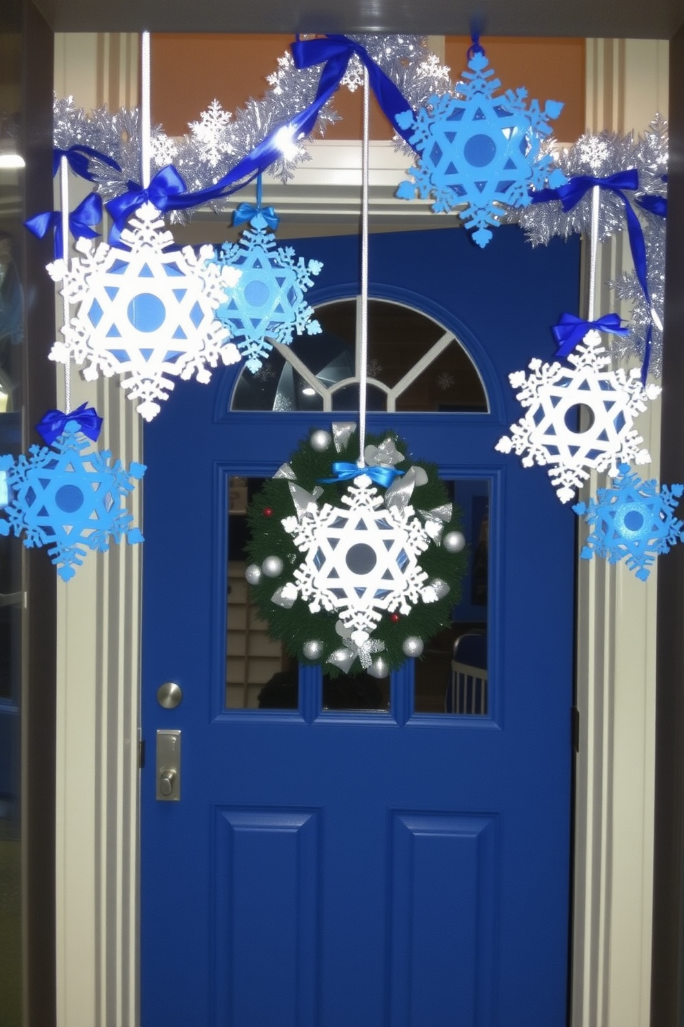 A festive front door decorated for Hanukkah features hanging snowflakes adorned with intricate dreidel designs. The entrance is enhanced with a vibrant blue and silver color scheme, welcoming guests with warmth and holiday cheer.