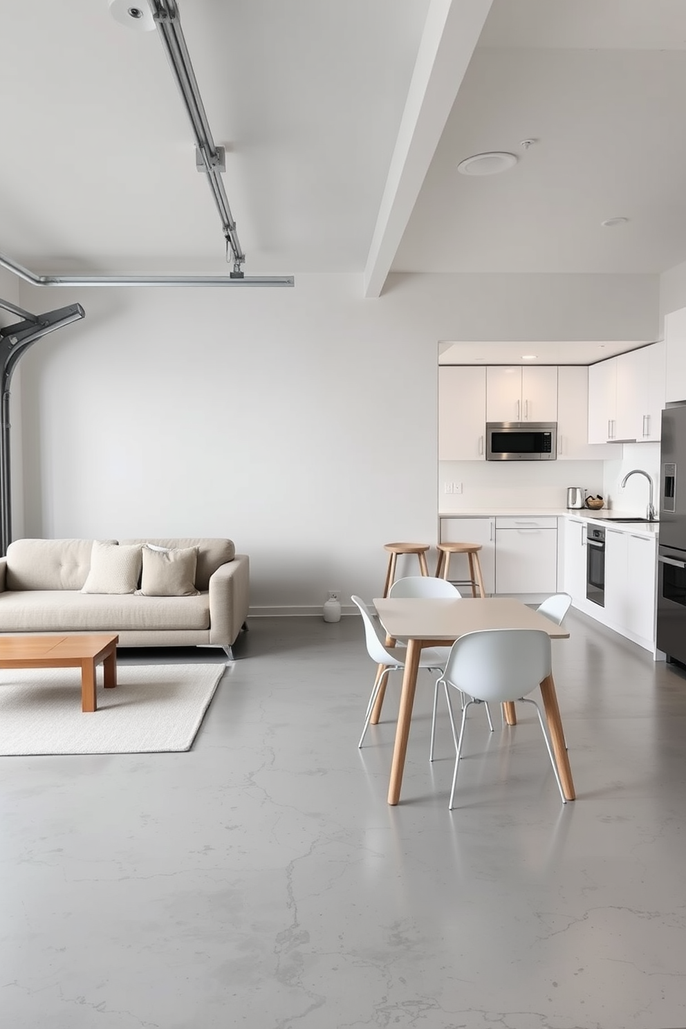 A sleek garage apartment with modern minimalist furniture choices. The living area features a low-profile sectional sofa in a neutral tone paired with a simple wooden coffee table. The kitchen boasts clean lines with white cabinetry and stainless steel appliances. A compact dining table with minimalist chairs sits adjacent to the kitchen, creating an open and airy feel.