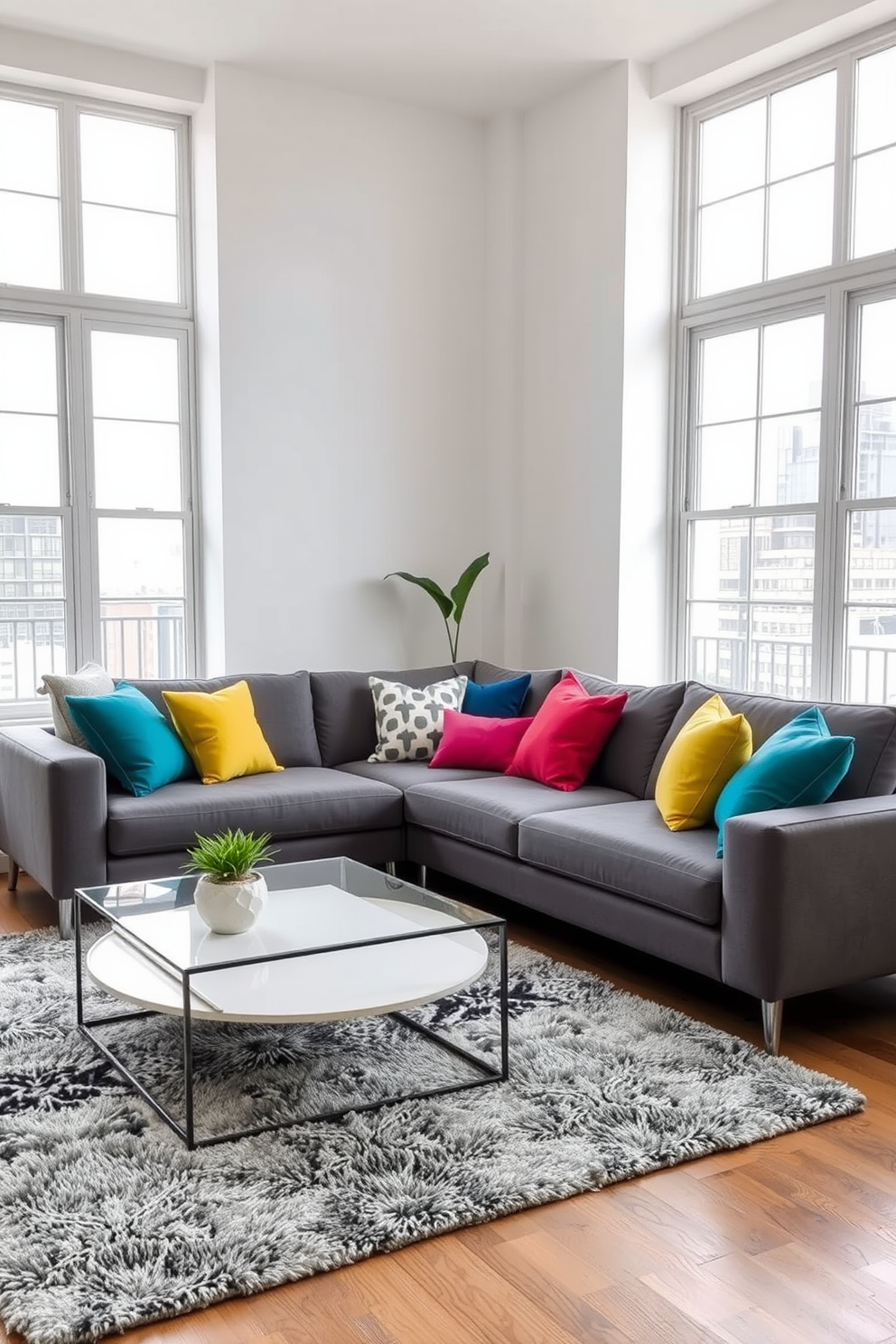 Cozy gray sectional sofa adorned with vibrant colorful pillows creating a warm and inviting atmosphere. The apartment features an open layout with large windows allowing natural light to fill the space, complemented by soft area rugs and contemporary art on the walls.