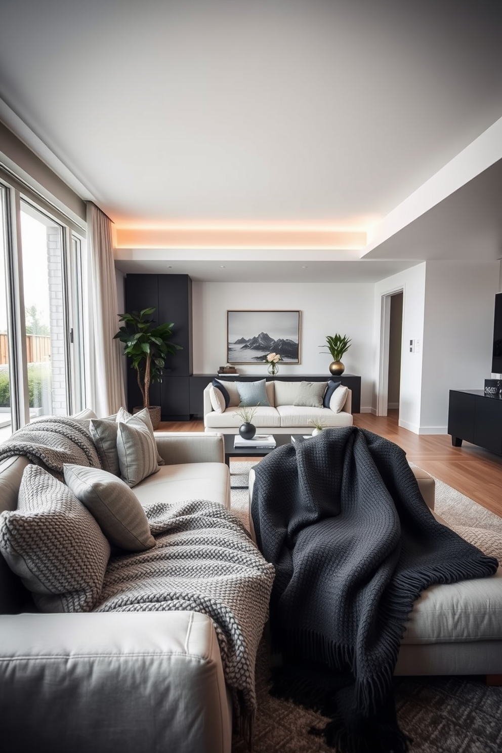 A modern apartment living room featuring textured gray throw blankets draped over plush sofas. The space is accented with sleek furniture, large windows allowing natural light, and minimalist decor elements that create a cozy yet sophisticated atmosphere.