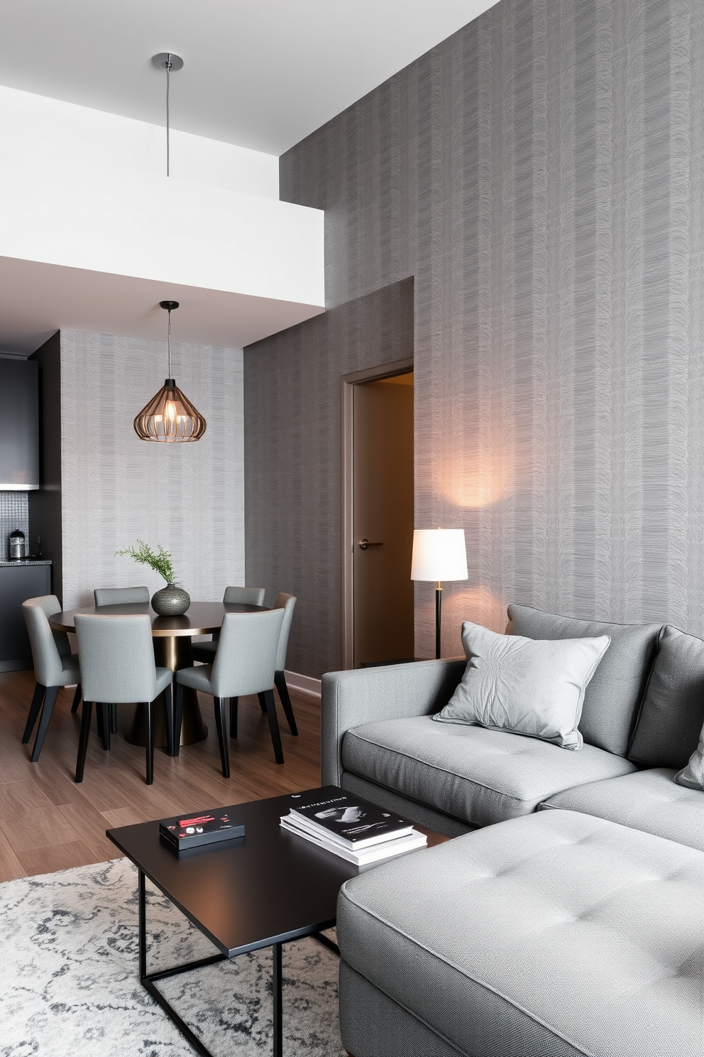 A modern dining area featuring gray dining chairs surrounding a sleek wooden table. The space is illuminated by a contemporary chandelier, creating an inviting atmosphere with a blend of textures and colors. The walls are painted in a soft gray hue, complementing the natural wood tones of the table. Large windows allow natural light to flood the room, enhancing the cozy yet sophisticated ambiance.