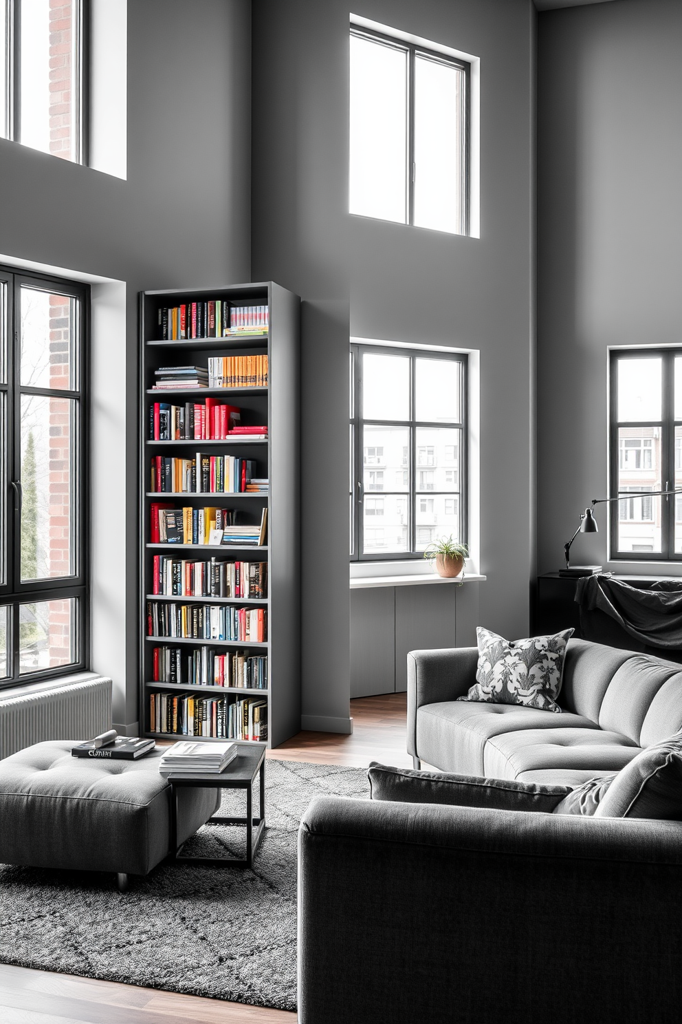 A stylish gray apartment featuring a spacious living area with modern furnishings. The walls are adorned with gray artwork framed in black, creating a striking contrast against the light gray backdrop. The open kitchen boasts sleek gray cabinets and stainless steel appliances, complemented by a chic island with bar stools. Natural light floods the space through large windows, enhancing the contemporary ambiance.