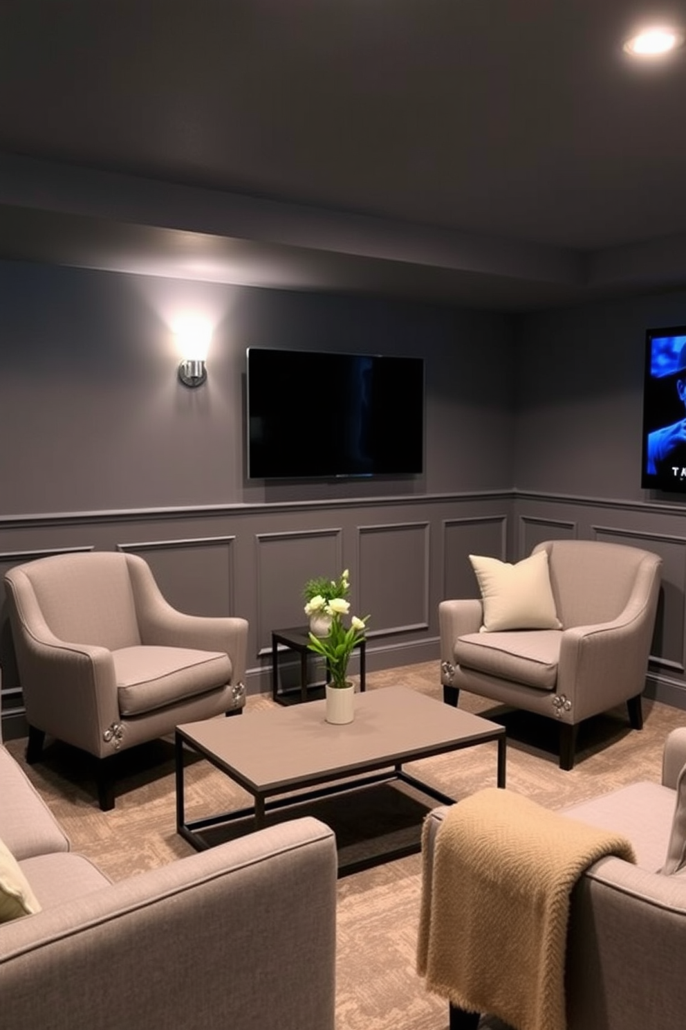 A cozy gray basement designed for relaxation and entertainment. The space features accent chairs upholstered in soft gray fabric, paired with a sleek coffee table in a contrasting color.