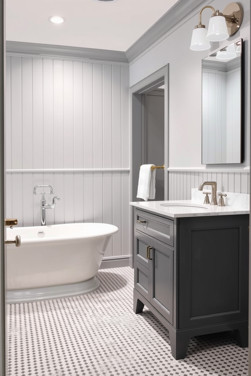 A classic gray bathroom featuring painted beadboard that adds texture and warmth to the space. The design includes a freestanding soaking tub with a brushed nickel faucet and elegant fixtures. Complementing the beadboard, a sleek gray vanity with a white marble top provides ample storage and style. Soft lighting fixtures above the vanity create a serene ambiance, enhancing the overall tranquil atmosphere.