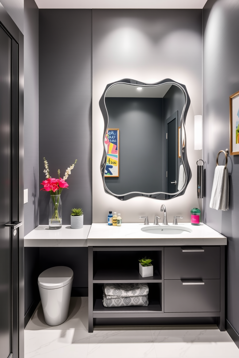 A modern bathroom featuring a gray and blue color palette that exudes freshness. The walls are painted in a soft gray, complemented by blue accents in the decor and accessories. The focal point is a sleek gray vanity with a polished white countertop. Above the vanity, a large round mirror with a minimalist frame reflects the stylish blue wall art.