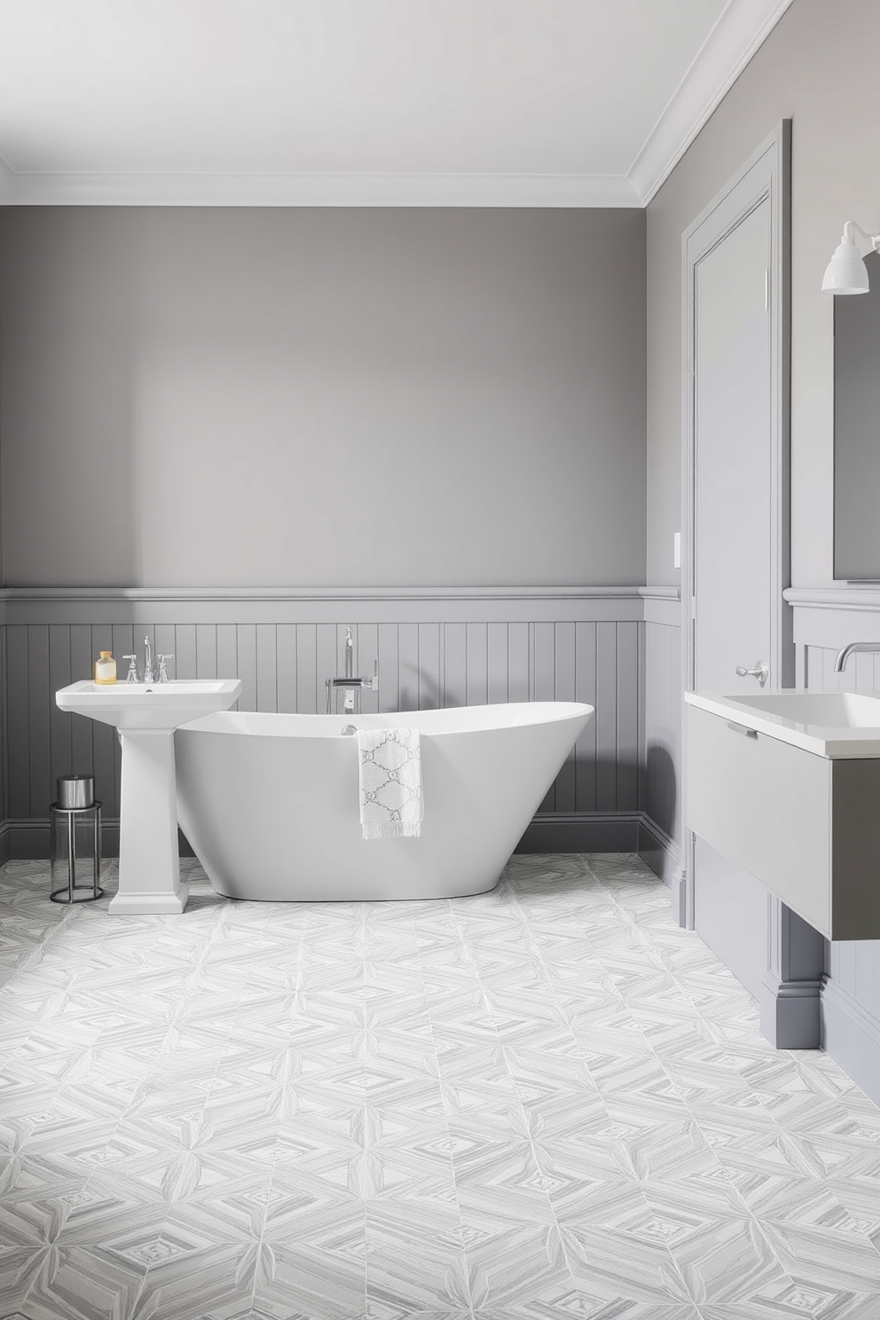 A sleek and modern bathroom featuring dark gray cabinets adorned with elegant gold hardware. The space is enhanced by a large frameless mirror that reflects the sophisticated design elements, creating an inviting atmosphere.