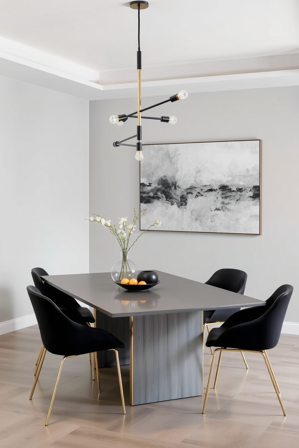 A modern dining room featuring a gray color palette with mixed metal accents. The table is a sleek gray finish with brushed nickel legs, surrounded by chairs that combine matte black and gold elements. The lighting fixture above the table is a statement piece with a combination of black and brass finishes. A large abstract artwork on the wall incorporates hints of silver and gold, tying the decor together beautifully.