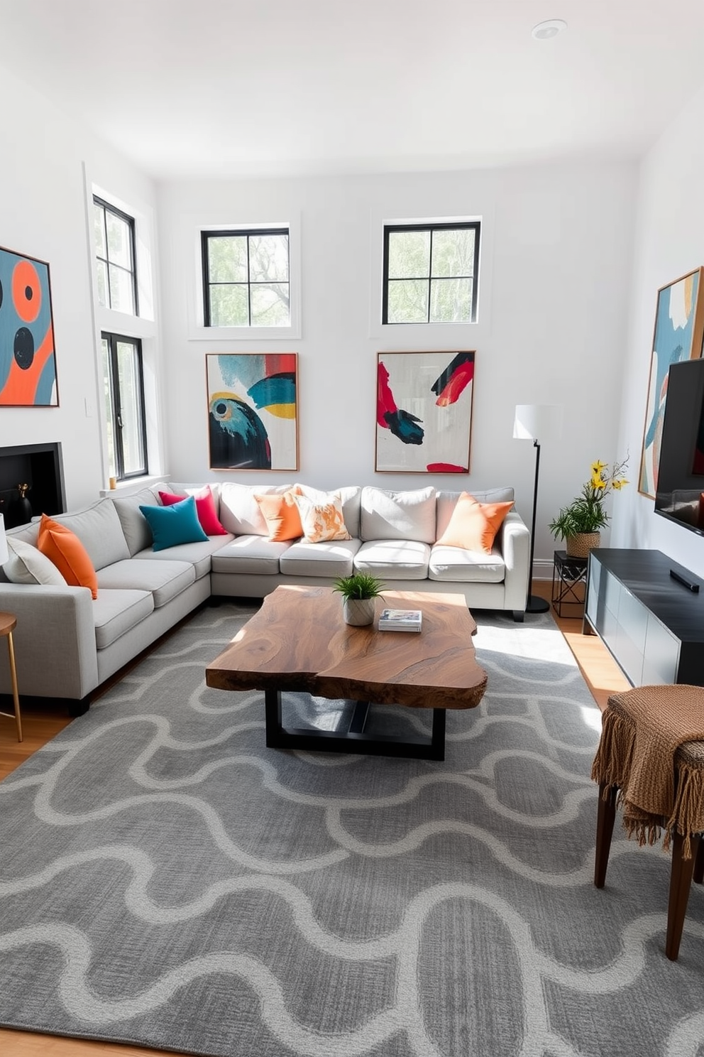 A contemporary family room featuring a geometric gray patterned area rug that anchors the space. The room is adorned with a comfortable sectional sofa in a light gray fabric, complemented by vibrant throw pillows in contrasting colors. Large windows allow natural light to flood the room, highlighting the sleek coffee table made of reclaimed wood. The walls are painted in a soft white, creating a clean backdrop for abstract art pieces that add a pop of color.