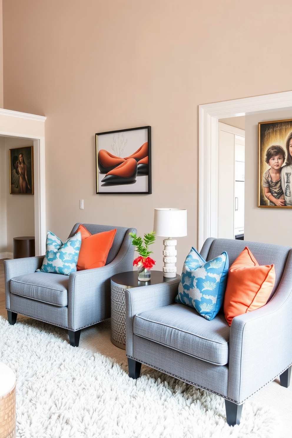 A stylish family room featuring gray accent chairs adorned with bold colorful cushions that pop against the neutral backdrop. The walls are painted in a soft beige, creating a warm and inviting atmosphere while a plush area rug anchors the seating arrangement.