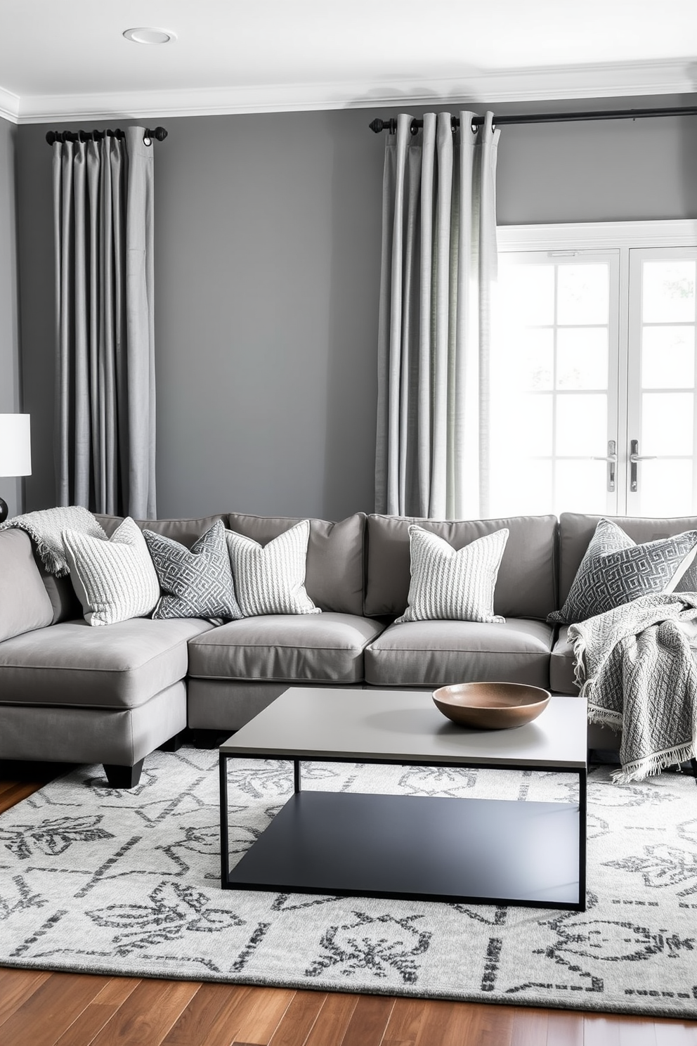 A family room designed with a monochromatic gray palette featuring various textures. The walls are painted in a soft gray, complemented by a plush gray sectional sofa adorned with textured throw pillows. A sleek gray coffee table sits in the center, surrounded by a cozy gray area rug with a subtle pattern. To add depth, a mix of gray curtains and a textured throw blanket drape over the sofa, enhancing the room's inviting atmosphere.