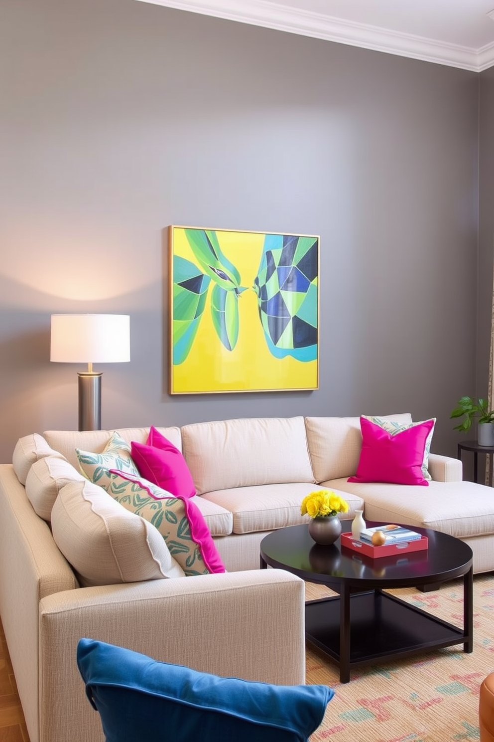 Bright artwork against gray walls. The family room features a comfortable sectional sofa in a light fabric, accented by vibrant throw pillows.