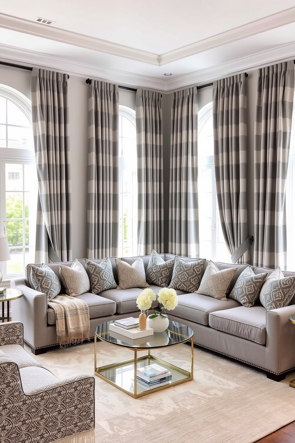 A cozy family room featuring gray and white striped curtains that gracefully frame large windows. The room is adorned with a plush sectional sofa in a soft gray fabric, complemented by a mix of patterned throw pillows and a stylish coffee table at the center.