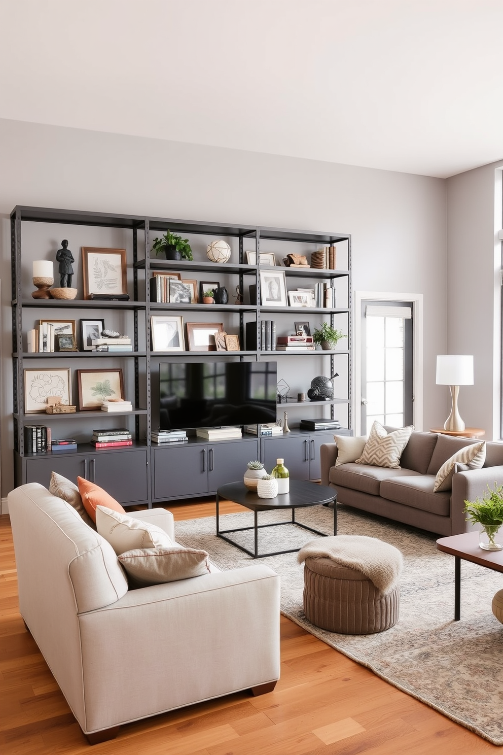 A spacious family room featuring industrial gray shelving that showcases a curated selection of decor items. The walls are painted in a soft gray hue, while the flooring consists of warm wooden planks that add contrast and warmth to the space.