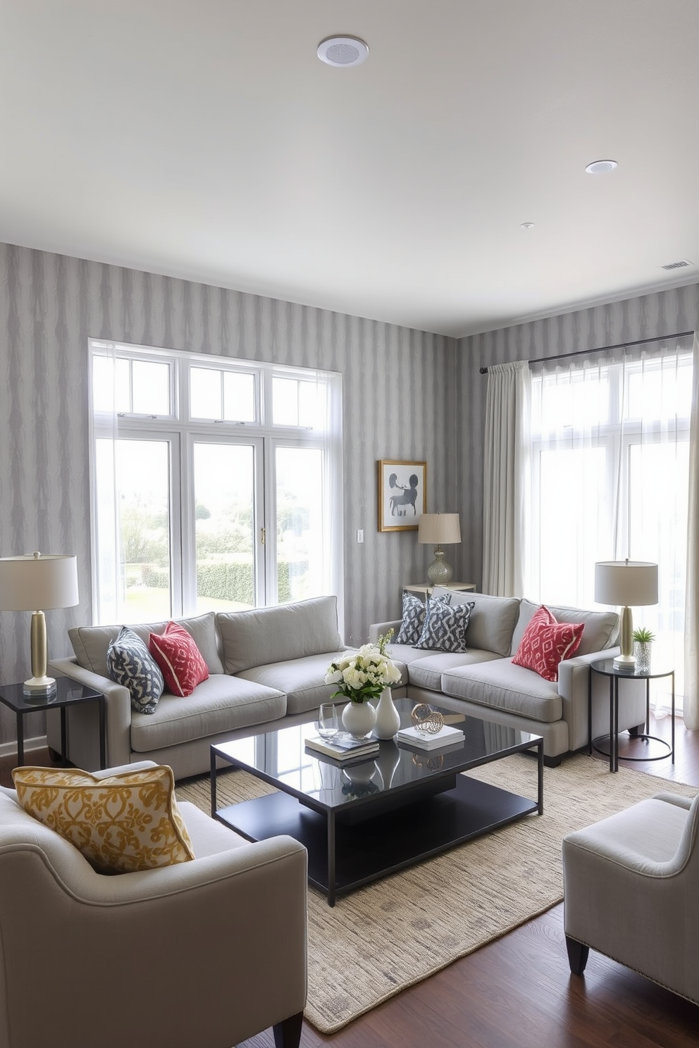 A cozy family room featuring warm gray tones complemented by natural wood accents. The space includes a plush gray sectional sofa adorned with textured throw pillows, and a reclaimed wood coffee table sits at the center. Large windows allow natural light to flood the room, highlighting the soft gray walls and a stylish area rug beneath the furniture. A wooden media console houses a flat-screen TV, while decorative shelves display family photos and curated decor items.