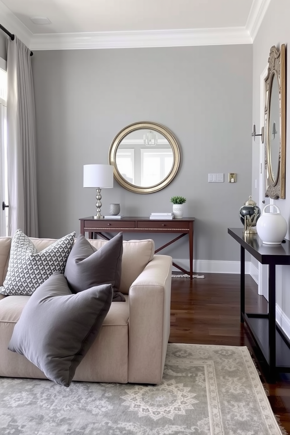 A stylish gray entryway table stands against the wall adorned with lush green plants in elegant pots. The space is illuminated by soft lighting, creating a welcoming atmosphere that invites guests into the home. The walls are painted in a light neutral tone, enhancing the gray tones of the table. A decorative mirror hangs above the table, reflecting the beauty of the plants and adding depth to the foyer.