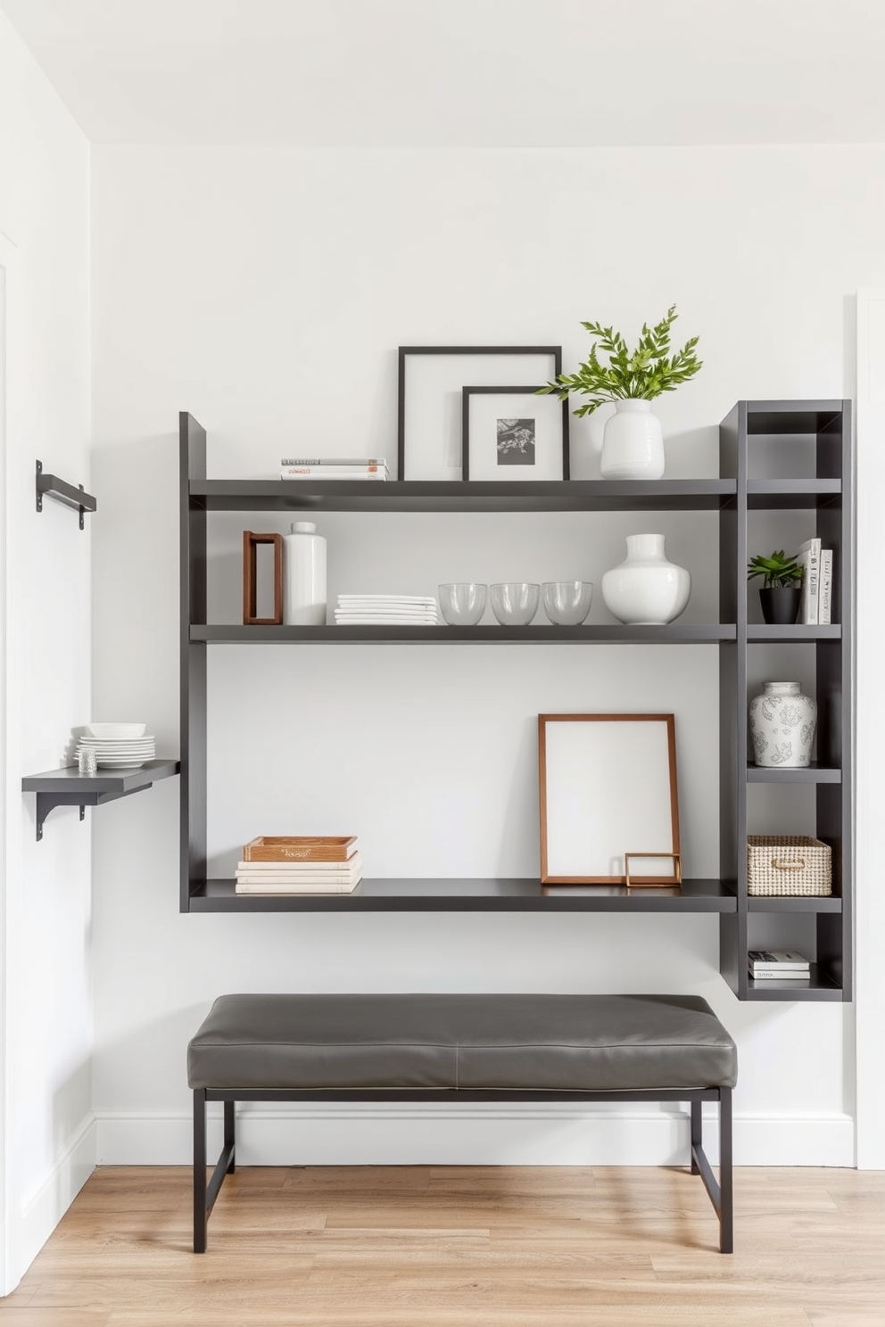 A modern foyer featuring industrial gray shelving that showcases functional decor items. The walls are painted in a soft white, creating a bright contrast with the dark shelving, while a sleek bench sits below the shelves.