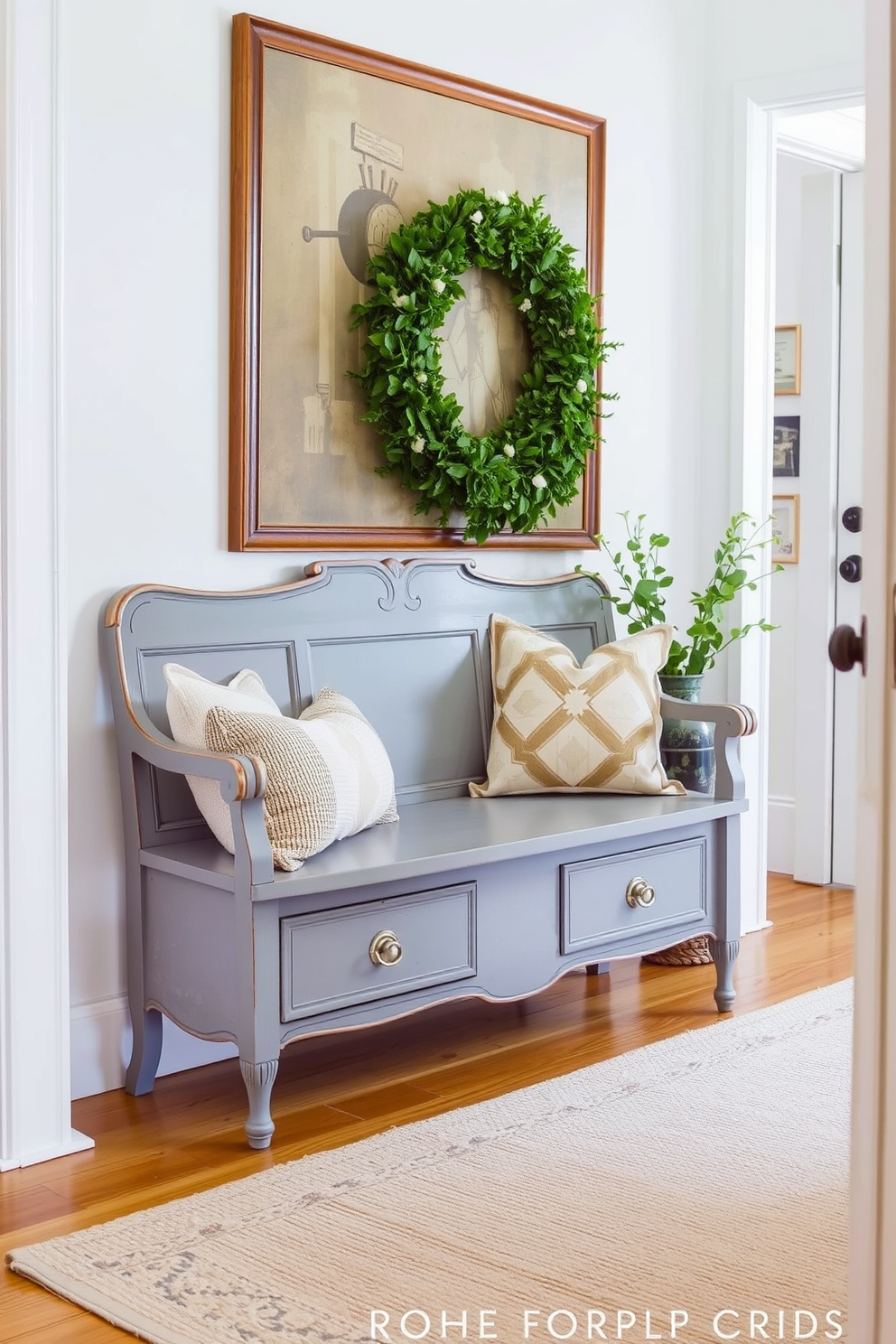 A vintage gray bench is placed against the wall, providing stylish seating for the foyer. The floor is adorned with a soft area rug, and the walls are painted in a light, airy color to enhance the welcoming atmosphere.