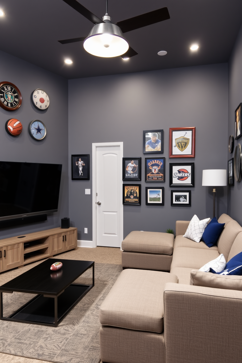 A stylish game room featuring gray walls adorned with framed sports memorabilia. The room includes a comfortable sectional sofa, a sleek coffee table, and a large flat-screen TV mounted on the wall.