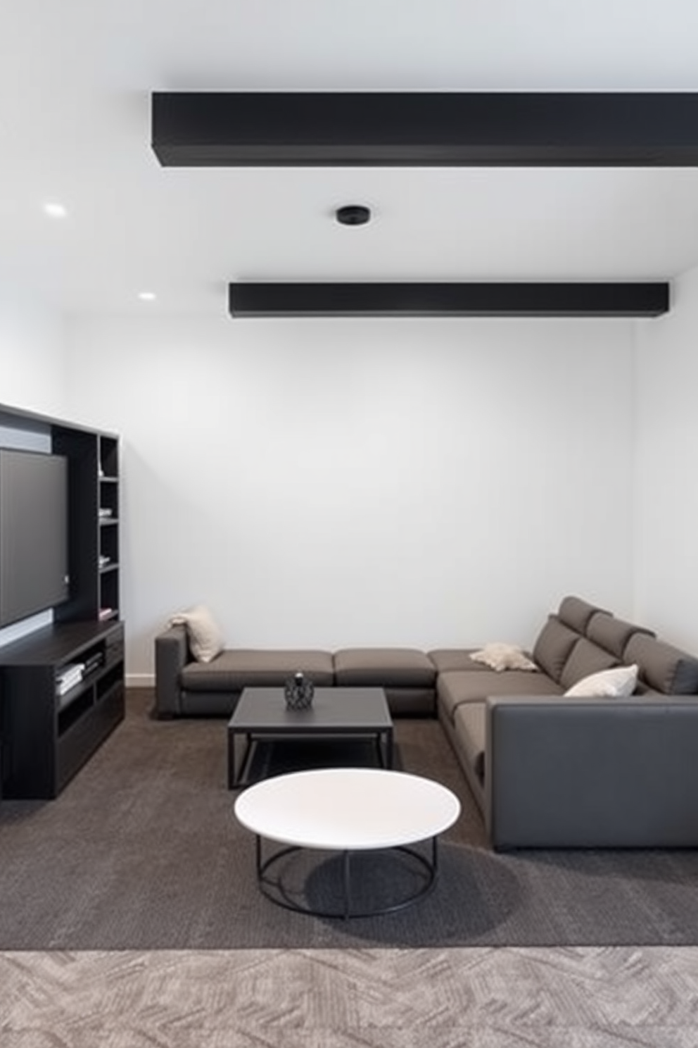 A minimalist game room featuring sleek gray furniture that emphasizes clean lines and functionality. The space includes a modern sectional sofa, a low-profile coffee table, and minimalist shelving to keep the area uncluttered.