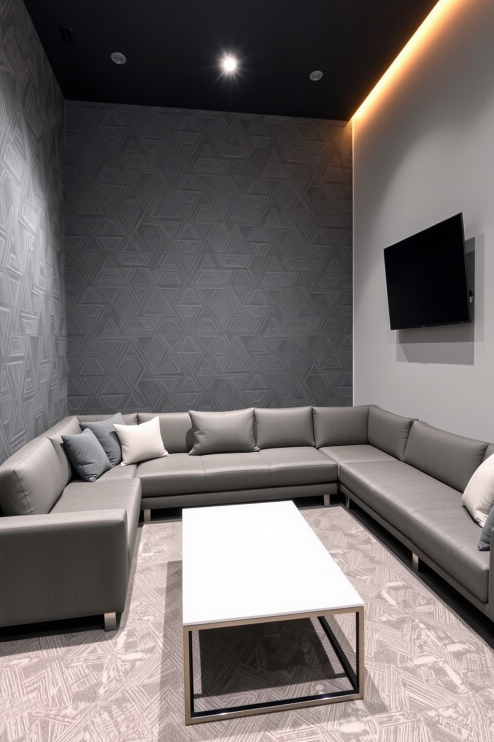 A modern game room featuring an accent wall adorned with gray geometric patterns. The space is equipped with a plush sectional sofa, a sleek coffee table, and a large flat-screen TV mounted on the wall.