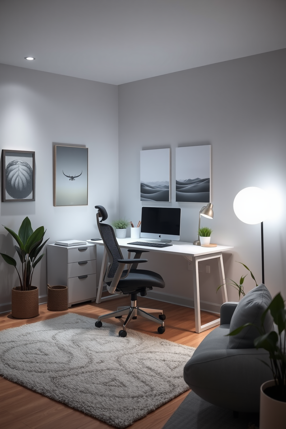 A serene home office space designed in neutral gray tones to create a calming effect. The room features a sleek gray desk paired with a comfortable ergonomic chair, with soft ambient lighting illuminating the area. The walls are adorned with minimalist artwork in subtle shades of gray, enhancing the tranquil atmosphere. A plush area rug in light gray adds warmth to the space, while a few potted plants bring a touch of nature indoors.