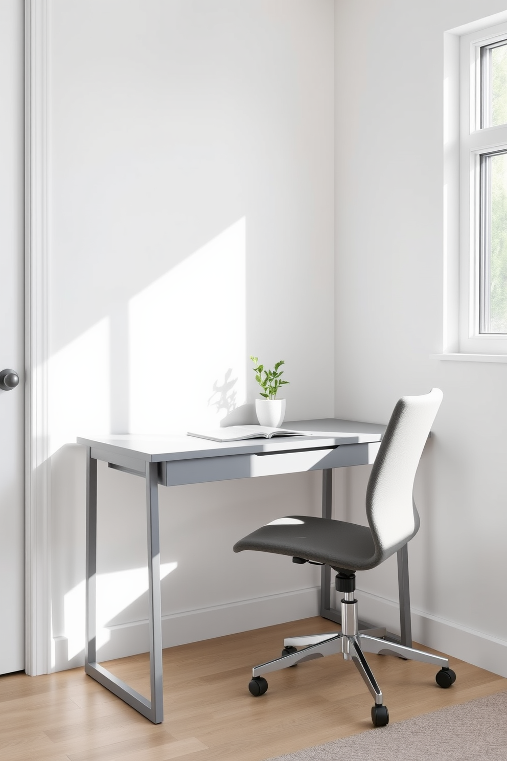 A compact gray desk is positioned against a light-colored wall in a small home office. The desk features clean lines and minimalistic design, complemented by a comfortable ergonomic chair. Natural light streams in through a nearby window, illuminating the space and enhancing the gray tones. A small potted plant sits on the desk, adding a touch of greenery to the modern aesthetic.