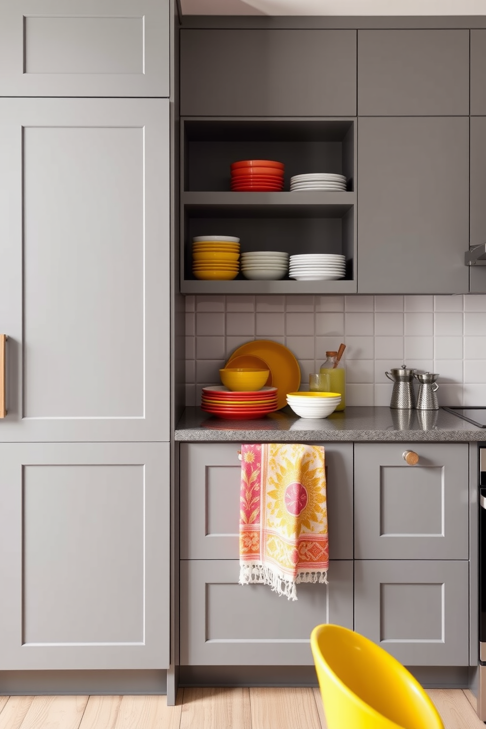 A contemporary kitchen featuring muted gray cabinetry that provides a sleek and elegant backdrop. Colorful accessories including bright dishware and vibrant kitchen towels add a playful contrast, creating a lively atmosphere.