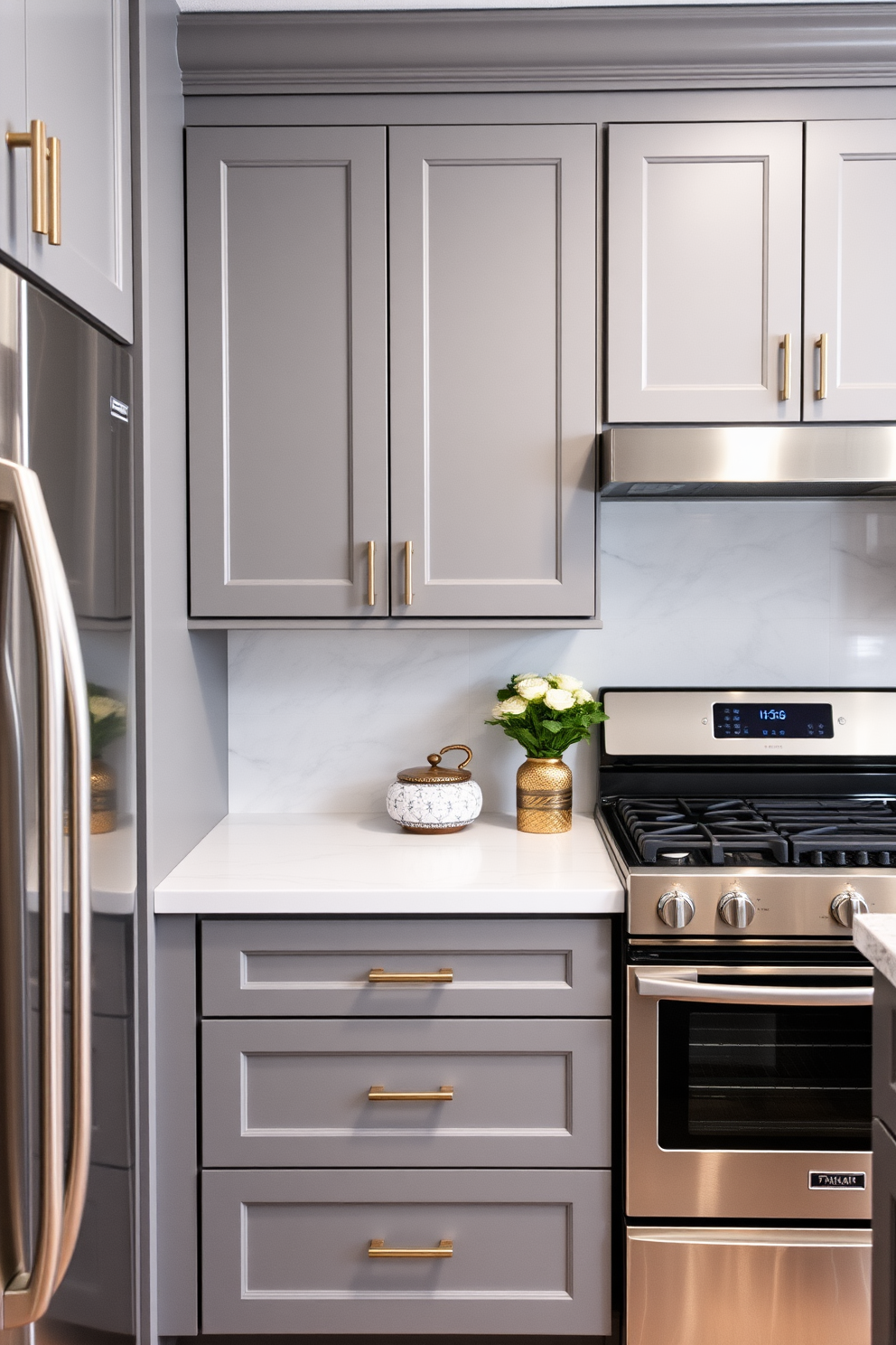 Classic gray cabinets with modern handles create a timeless yet contemporary kitchen aesthetic. The space is accented with sleek stainless steel appliances and a white marble backsplash that enhances the overall elegance.