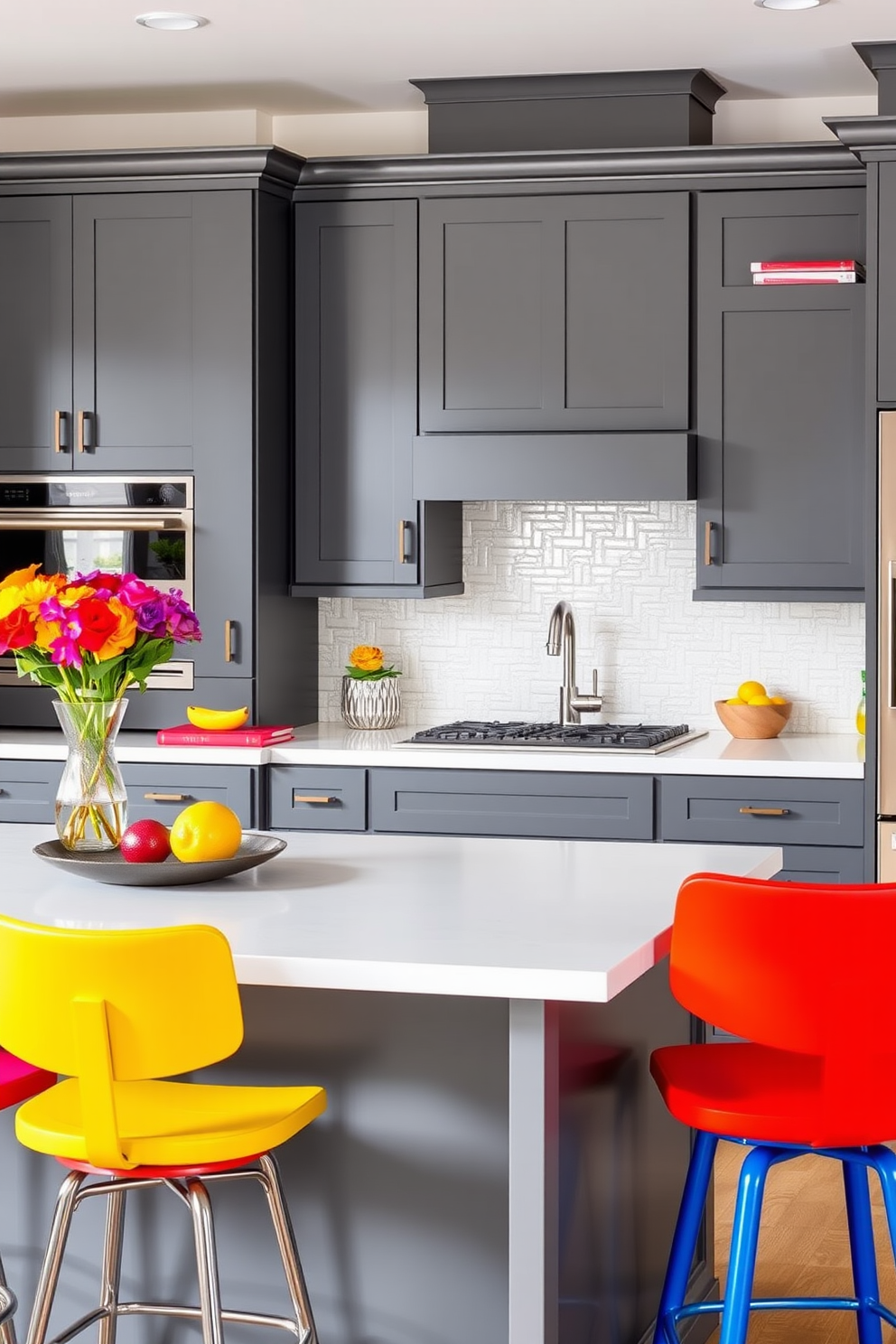 A modern kitchen featuring bold gray cabinets complemented by colorful accents throughout the space. The countertops are a sleek white quartz, and vibrant bar stools add a pop of color to the breakfast island.