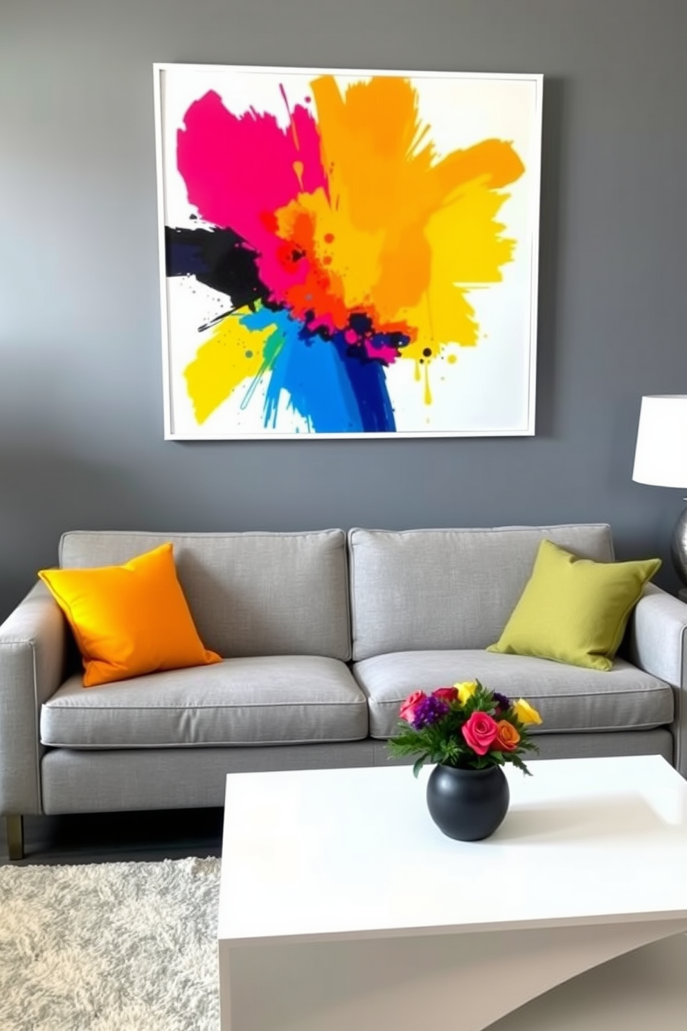 Bright artwork against a gray wall creates a striking focal point in the living room. The space is furnished with a plush gray sofa and a sleek coffee table, complemented by colorful throw pillows that echo the artwork's vibrant hues.